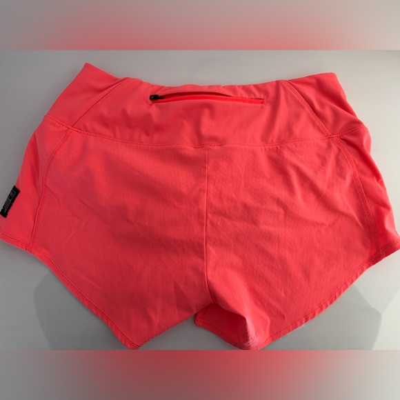 Oiselle Women's Roga Shorts in bright coral - Picture 2 of 5